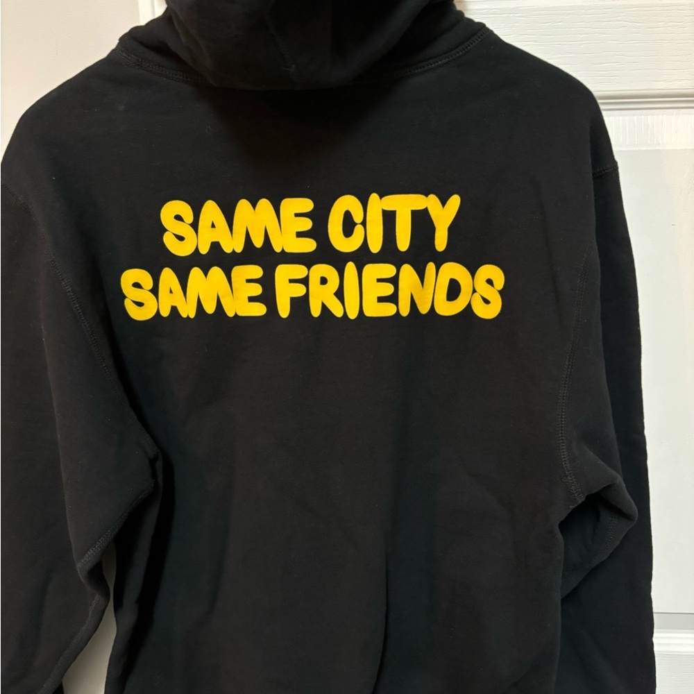 Black and Yellow Sweater with Bold Text